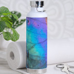 Trendy Modern Marble Stone Colorful Water Bottle<br><div class="desc">Stunning and colorful rainbow hued labradorite stone photo makes the perfect backdrop for a simple and modern design. This is a closeup of a real natural labradorite stone with blue,  purple,  pink,  yellow,  and green.  Chic Modern Stylish Crystal Stone Colorful Water Bottle</div>