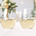 Trendy Personalized Floral Bridesmaid Stemless Wine Glass<br><div class="desc">Looking for a chic, trendy, yet simple gift for your Bridesmaids? These wildflower floral modern script stemless wine glasses are a practical gift that they can use even after your wedding day! All text, including title (optional) and script names, can be changed. You can change the title to fit your...</div>