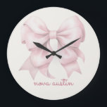 Trendy Pink Bow Personalized With Name Monogram Large Clock<br><div class="desc">Add a touch of timeless elegance to your decor with the Trendy Pink Bow Personalized With Name Monogram Large Clock. Featuring a chic preppy coquette bow in a soft pink watercolor design, this clock combines vintage girly charm with modern sophistication. The personalized name monogram makes it a unique and thoughtful...</div>