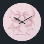 Trendy Pink Bow Personalized With Name Monogram Large Clock<br><div class="desc">Transform any room with the Trendy Pink Bow Personalized With Name Monogram Large Clock, a perfect blend of style and personalization. This elegant clock features a preppy coquette bow in a soft pink watercolor design, making it a charming addition to any space. The personalized name monogram adds a unique touch,...</div>