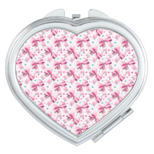 Trendy pink coquette bow pattern with cute girly compact mirror