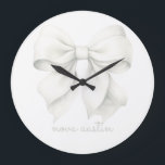Trendy White Bow Personalized With Name Monogram Large Clock<br><div class="desc">Elevate any room with the Trendy White Bow Personalized With Name Monogram Large Clock, a stunning blend of classic charm and modern style. Featuring a delicate watercolor white bow, this clock is perfect for adding a touch of elegance to a baby girl’s room or a stylish office. Its versatile design...</div>