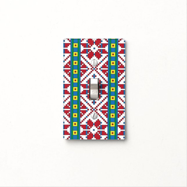 Tribal red, blue, and white star geometric pattern light switch cover (In Situ)