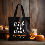 Trick or Treat Modern Script Custom Halloween Tote Bag<br><div class="desc">These scary cute Halloween tote / candy bags feature "Trick or Treat" in modern white script with an orange jack o'lantern pumpkin accent and black background color.</div>