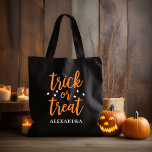 Trick or Treat Orange Modern Script Halloween Tote Bag<br><div class="desc">Celebrate Halloween in style with this "trick or treat" candy tote bag featuring modern orange script lettering and white star accents. Personalize the custom monogram text with an individual name or family name.</div>