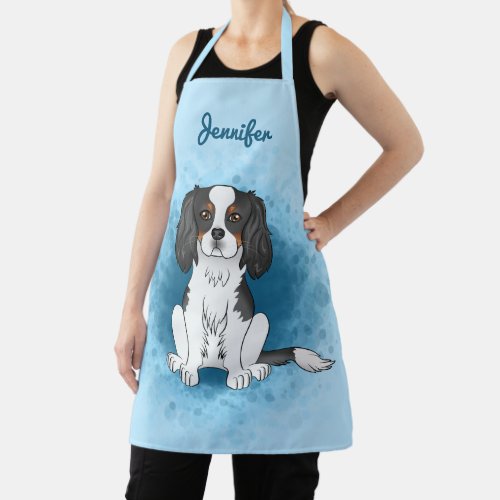 Tricolor Cavalier King Charles Spaniel Dog On Blue Apron