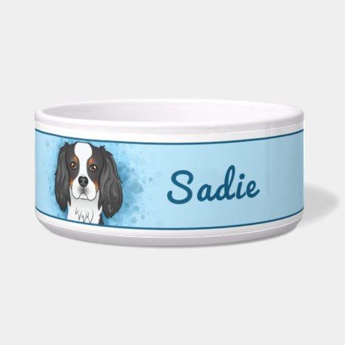 Tricolor Cavalier King Charles Spaniel Dog On Blue Bowl