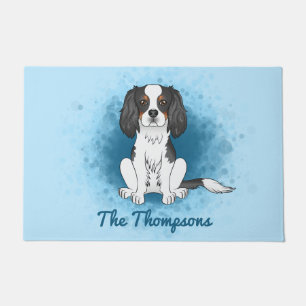 Tricolor Cavalier King Charles Spaniel Dog On Blue Doormat