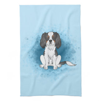 Tricolor Cavalier King Charles Spaniel Dog On Blue Kitchen Towel