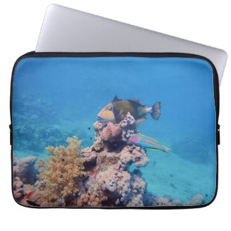 Triggerfish rests on a coral block at coral reef | laptop sleeve