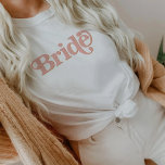 TRIXIE Retro 70's Themed Blush and Orange Bride T-Shirt<br><div class="desc">This bride bachelorette t shirt features a retro 70's themed font in blush and orange coloring. Order the white bride option for the bride-to-be and the coordinating orange 'babe' shirts for your bachelorette group. Colors are editable! Click 'edit design' to create your own colors.</div>