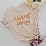 TRIXIE Retro 70's Themed Maid of Honor T-Shirt<br><div class="desc">This maid of honor t shirt features a retro 70's themed font with a creamy orange coloring. This shirt makes the perfect gift for the entire wedding party. Just search the Trixie Collection to find all coordinating text. 💜 COLORS ARE EDITABLE!  Click 'edit design' to create your own colors.</div>