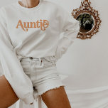 TRIXIE Retro 70's Themed Orange Groovy Auntie Sweatshirt<br><div class="desc">This auntie sweatshirt features an orange retro 70's themed font and simple design. This pull over makes the perfect gift to announce a new baby or for the cool aunt in your life. Colors are editable! Click 'edit design' to change the colors.</div>