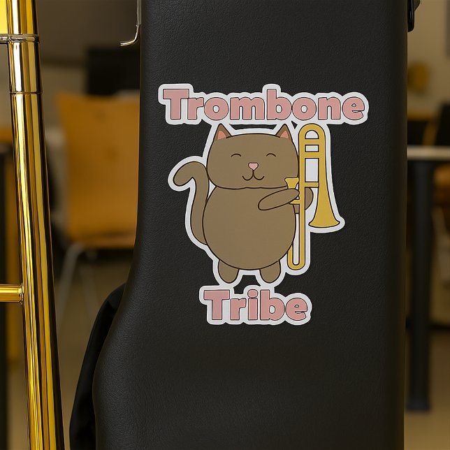 Trombone Tribe Cute Brown Cat Pink Letters Sticker (A sticker of a brown cat holding a trombone and the words trombone tribe)
