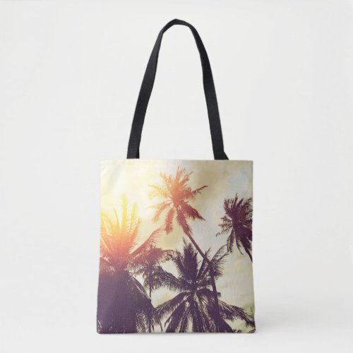 Tropical beach background with palm trees silhouet tote bag