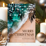 Tropical Beach Christmas Holiday Card<br><div class="desc">Elegant beach destination christmas holiday card featuring a tropical sandy shoreline,  ocean waves,  romantic palm leaves,  string lights,  seasons greetings,  and your name.</div>