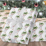 Tropical Beach Christmas Wrapping Paper<br><div class="desc">Bring a coastal twist to your holiday gifts with this festive wrapping paper featuring a repeating pattern of a watercolor palm tree decorated with colorful Christmas lights. Three holiday stockings hang playfully from the fronds, and soft beach sand rests at the base for a warm, tropical vibe. The pattern also...</div>