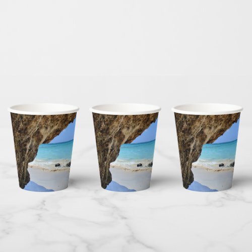 Tropical Beach Coast with a Big Rock Paper Cups