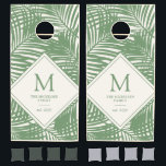 Tropical Beach Family Name Monogram Palm Pattern  Cornhole Set<br><div class="desc">Modern Tropical Beach House Monogrammed Family Name Corn Hole Boards in Sage Green and off-white palm tree leaf pattern. This customized Beanbag Toss Game Board Set is custom printed with your Family Name and initial. The overlapping leaf pattern is perfect for a contemporary beach or lake house or tropical-inspired backyard....</div>