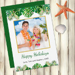Tropical Beach Foliage Christmas Lights Gold Photo Holiday Card<br><div class="desc">This fun, modern holiday card design features lush tropical beach foliage on the front, decorated with glowing multicolored lights, at the top and bottom. In the middle is a customizable gold-edged square photo that you can replace with your own. Below the photo are two customizable text lines so that you...</div>
