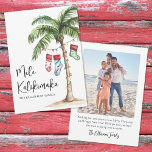 Tropical Beach Mele Kalikimaka Christmas Holiday Card<br><div class="desc">Get into the holiday spirit with this festive watercolor Christmas card featuring a large palm tree wrapped in colorful Christmas lights. Three holiday stockings hang playfully from the fronds, while soft beach sand rests at the base—bringing a warm and tropical twist to your holiday greetings. The front features "Mele Kalikimaka"...</div>