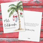 Tropical Beach Mele Kalikimaka Christmas Holiday Card<br><div class="desc">Get into the holiday spirit with this festive watercolor Christmas card featuring a large palm tree wrapped in colorful Christmas lights. Three holiday stockings hang playfully from the fronds, while soft beach sand rests at the base—bringing a warm and tropical twist to your holiday greetings. The front features "Mele Kalikimaka"...</div>