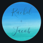 Tropical Blue & Green Beach Wedding Classic Round Sticker<br><div class="desc">This simple, beachy wedding design features a watercolor painted background of deep blues and greens. Click the customize button for more flexibility in modifying the text! Variations of this design as well as coordinating products are available in our shop, zazzle.com/doodlelulu*. Contact us if you need this design applied to a...</div>