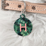 Tropical Botanical Monogram Pet ID Tag<br><div class="desc">Tropical chic ID tag for your furbaby features a single initial monogram in vibrant beachy coral,  on a pattern of green botanical jungle leaves on a black background. Personalize with your pet's name and your contact details on the reverse side.</div>
