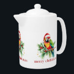 Tropical Christmas Bird Retro Merry Christmas Teapot<br><div class="desc">This tropical theme Christmas paper cup design features a tropical bird with a Santa hat holiday greenery and red retro Merry Christmas typography.
Get cozy this holiday season with this mug full of your favorite beverage.</div>