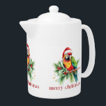 Tropical Christmas Bird Retro Merry Christmas Teapot<br><div class="desc">This tropical theme Christmas paper cup design features a tropical bird with a Santa hat holiday greenery and red retro Merry Christmas typography.
Get cozy this holiday season with this mug full of your favorite beverage.</div>