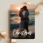 Tropical Christmas Couple Beach Sunset Photo Holiday Card<br><div class="desc">This holiday card is perfect for couples who love the beach! It shows a beautiful sunset over the ocean, making it feel warm and cozy. With its simple and elegant design, it captures the joy of the season. It's a great way to share your love and happiness during Christmas! This...</div>