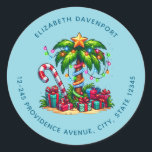 Tropical Christmas Palm Tree Address Classic Round Sticker<br><div class="desc">Address stickers with a seasonal holiday image. A tropical palm tree decorated in festive lights with a star on top. A giant red and white candy cane sticking out of the sand. Christmas presents under the tree. Whimsical and fun.</div>