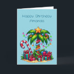 Tropical Christmas Palm Tree Birthday Card<br><div class="desc">Birthday card with a seasonal holiday image. A tropical palm tree decorated in festive lights with a star on top. A giant red and white candy cane sticking out of the sand. Gifts under the tree. Whimsical and fun.</div>