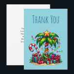 Tropical Christmas Palm Tree Thank You Card<br><div class="desc">Thank you card with a seasonal holiday image. A tropical palm tree decorated in festive lights with a star on top. A giant red and white candy cane sticking out of the sand. Christmas presents under the tree. Whimsical and fun.</div>