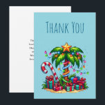 Tropical Christmas Palm Tree Thank You Card<br><div class="desc">Thank you card with a seasonal holiday image. A tropical palm tree decorated in festive lights with a star on top. A giant red and white candy cane sticking out of the sand. Christmas presents under the tree. Whimsical and fun.</div>