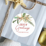 Tropical Christmas Starfish Seas N Greetings Classic Round Sticker<br><div class="desc">These tropical Christmas stickers make great envelope seals to add a coastal beach touch to your holiday mail,  with two starfish decorated with holly leaves,  berries and pine sprigs,  and the beachy saying “seas n’ greetings.”</div>