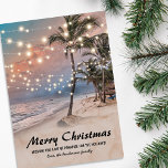 Tropical Coastal Beach Christmas Holiday Card<br><div class="desc">Vintage beach christmas holiday card featuring a sunset tropical beach setting with lush palm trees,  string twinkle lights,  seasons greetings,  and your name.</div>