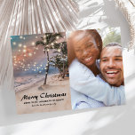 Tropical Coastal Beach Christmas Photo Holiday Card<br><div class="desc">Vintage beach christmas holiday card featuring a sunset tropical beach setting with lush palm trees,  string twinkle lights,  a pfamily photo,  seasons greetings,  and your name.</div>