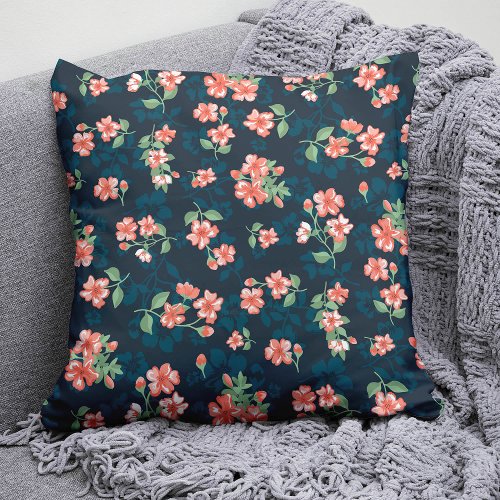 Tropical coral flowers among leafy green foliage throw pillow