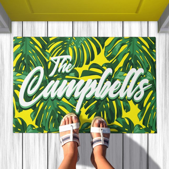 Tropical Family Name Green Yellow Palm Leaves Doormat (Doormat with pattern of green palm leaves on yellow background. Text overlay says your family name)