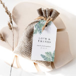 Tropical Foliage Wedding Favor Gift Tags<br><div class="desc">Attach these island chic tags to your wedding favors to say thank you to guests in elegant style. White tags feature a tropical watercolor palm frond leaves in lush green peeking out from the top and bottom, with "love and thanks" and your names and wedding date. All text is editable...</div>