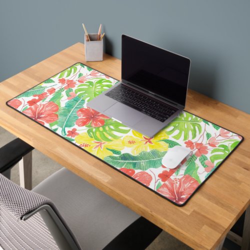 Tropical garden hibiscus plumeria and palm leaves desk mat