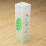Tropical Green Leaves Watercolor Monogram Wine Box<br><div class="desc">Romantic splash of soft pink, green, yellow, blue tropical watercolor wash with green leaves on sides and back of Wedding Favor Wine Boxes. Lovely for your reception favor gifts for wine or champagne bottles tucked inside, or for anniversary or other special occasions. Personalize with the Bride and Grooms First Name...</div>