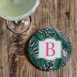 Tropical Green Palm Leaves Pink Monogram Coaster<br><div class="desc">Tropical girly style coaster design features a green palm and monstera leaf pattern of layered fronds with pastel pink background. White decorative frame has a monogram letter in bright hot pink (can be customized) that you can personalize with your last name initial.</div>