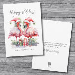Tropical Happy Holidays Christmas Holiday Card<br><div class="desc">Tropical Happy Holidays Flamingo Christmas Holiday Card. Happy Holidays! Add a tropical touch to your season's greetings with this charming card featuring two pink flamingos in Santa hats, facing each other in a sweet and festive pose, surrounded by colorful Christmas presents. The flamingos are centered on the card, making it...</div>