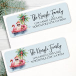 Tropical Holiday Return Address Label<br><div class="desc">Tropical Santa Christmas Return Address Label. This festive return address label features a relaxed Santa Claus lounging in a pink flamingo floaty, surrounded by tropical holiday details like a palm tree decorated with ornaments, gentle ocean waves, and a small island in the background. The charming watercolor artwork appears on the...</div>