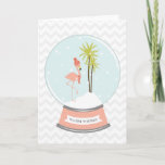 Tropical Island Flamingo Christmas Pink Holiday Card<br><div class="desc">A winter / Christmas card featuring an illustration of a pink flamingo inside a snowglobe.  
Flamingo is wearing a red striped scarf and hat while perched on a snow island covered with two palm trees.  Pink base says,  "WARM WISHES."  Background is gray chevron.</div>