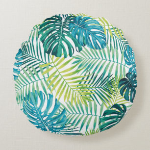 Tropical leaf design featuring green/blue palm and round pillow