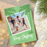 Tropical Merry Christmas Photo Holiday Card<br><div class="desc">Summer destination christmas cards featuring a bright green background,  a photo for you to replace with your own,  tropical beach palm trees,  the seasons greetings 'merry christmas',  and your family name.</div>