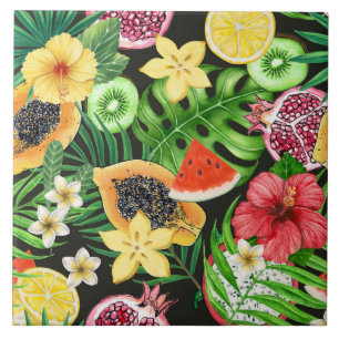 Tropical mix-fruit, flowers and leaves on black ceramic tile